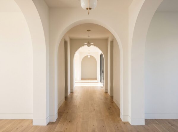 Elegant hallway with curved drywall archways finished perfectly smooth