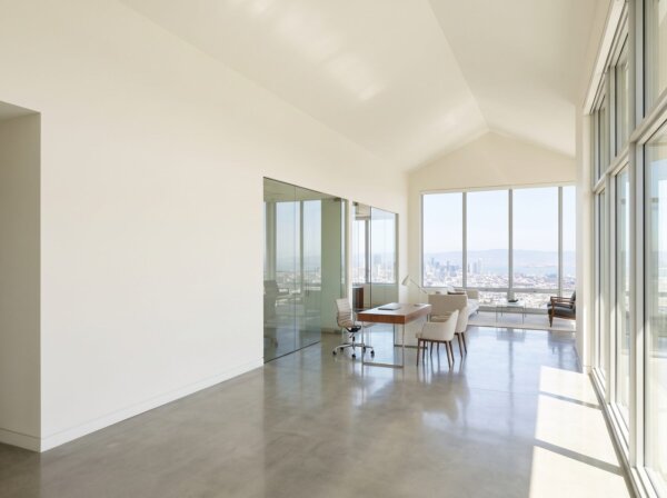 Completed commercial interior with straight finished drywall partitions on steel framing