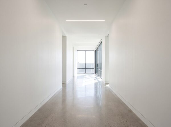 Commercial corridor with smooth finished fire-rated drywall assemblies